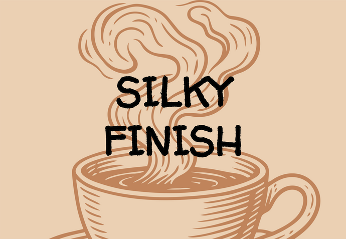 Illustration of a steaming coffee cup with 'SILKY FINISH' text on a beige background