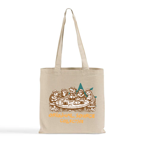 Beige tote bag with Original Source Collective animal graphic design and text on a white background